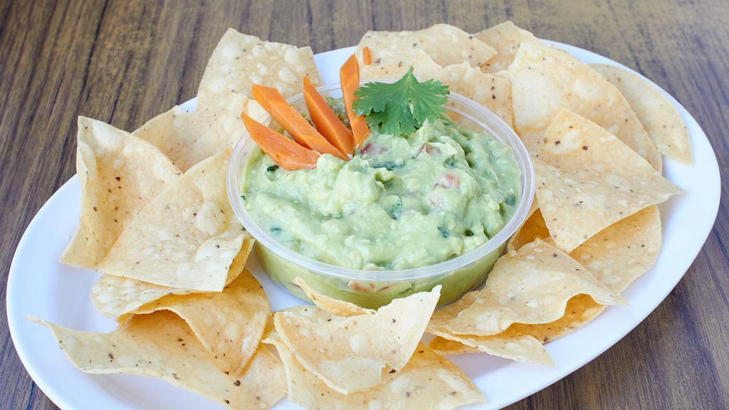 Guacamole Dip & Chips (6 oz.) · Fresh handcrafted guacamole and house-made chips. Serves 2-3 persons.