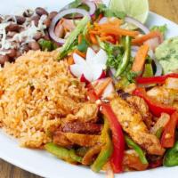 Baja Grilled Fish Dinner · Huachinango snapper a la plancha with rice, beans, avocado salad and tortillas.