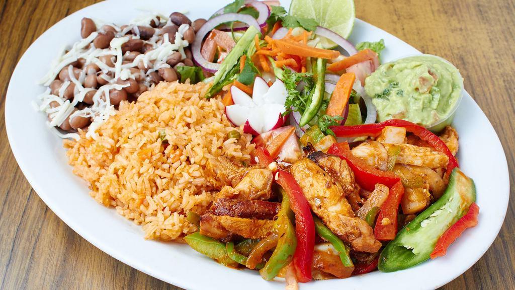 Baja Grilled Fish Dinner · Huachinango snapper a la plancha with rice, beans, avocado salad and tortillas.