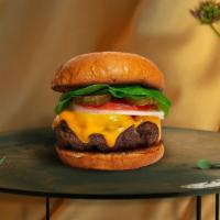 Vegan Cheese Burger · Seasoned 1/3 lb. Impossible meat patty topped with melted vegan cheese, lettuce, tomato, oni...