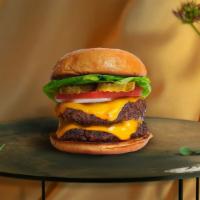 Vegan Cheese Double Burger · Two seasoned 1/3 lb. Impossible meat patties topped with melted vegan cheese, lettuce, tomat...