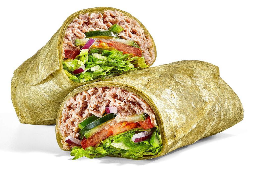 Tuna · Our tasty Tuna Wrap is completely cravable. It has a double serving of 100% wild caught tuna mixed with mayo in a spinach wrap. Then it gets topped with any crunchy veggies you want.