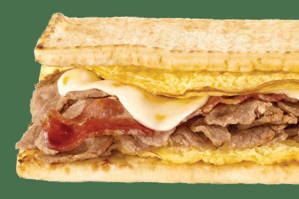 Steak, Egg & Cheese Wrap · No matter what side of the bed you wake up on, you'll love this. Enjoy American cheese and a double portion of egg and tender shaved steak on a delicious Tomato Basil wrap. Oh, what a beautiful breakfast.