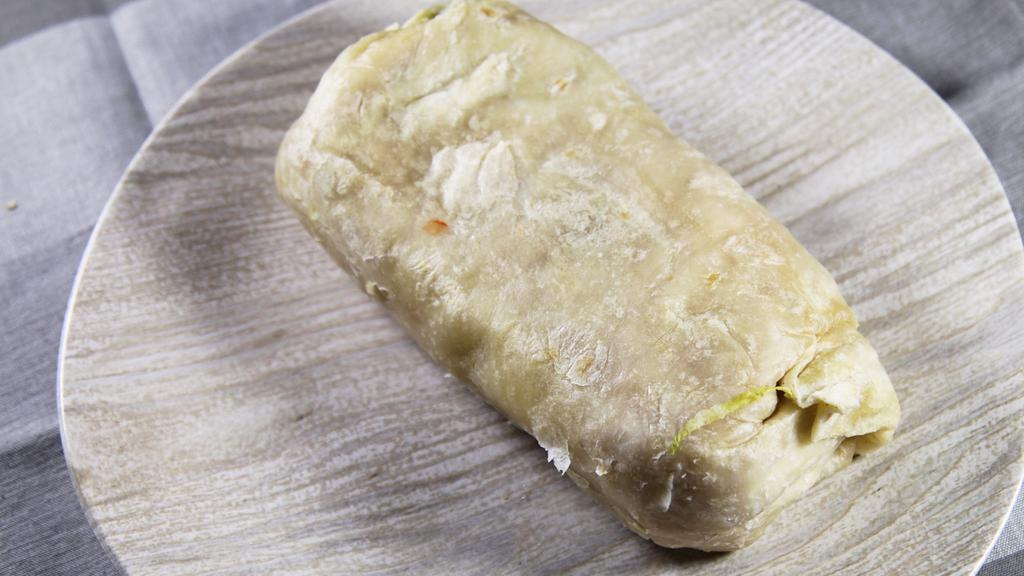 Regular Burrito · Beans, rice, cheese, tomato and your choice of beef, chicken, pastor or pork.