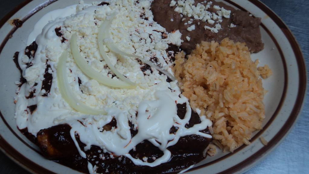 3 Enchiladas en Mole · Topped with our mole sauce, cheese and sour cream and your choice of chicken or cheese.
