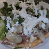 Tostadas · Served with beans, Mexican cheese, lettuce and your choice of beef feet, chicken and tinga (...
