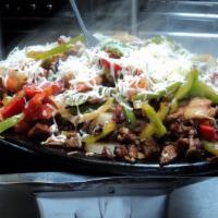 Alambres Fajita · Grilled bell pepper, onion, bacon and chorizo topped with cheese and your choice of beef, ch...