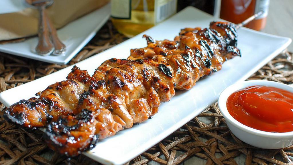 Chicken Bbq (Each) · Sweet, salty, a tad spicy Filipino-style Kebob, thin sliced Chicken marinated in Filipino-style barbecue sauce and skewered in bamboo sticks.