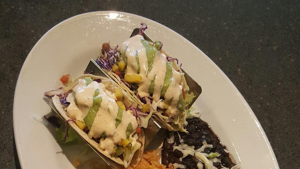 App Shrimp Taco · With mango salsa, guacamole, shredded mixed cabbage, and roasted red pepper ranch.
