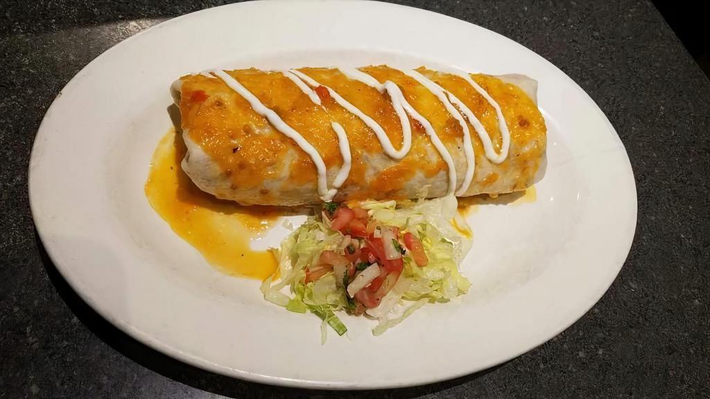 Super Relleno · A flour tortilla, stuffed with rice, pinto beans, guacamole, sour cream, and chile relleno. Topped with ranchero sauce.