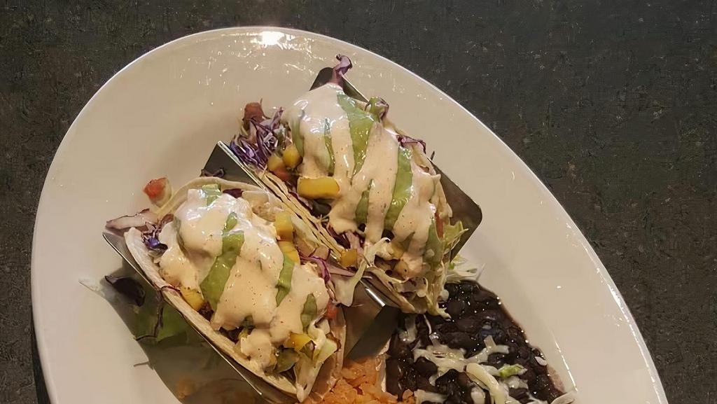 Fish Soft Taco (2) · Grilled Tilapia with mango salsa, guacamole, cheese, black beans and rice, cabbage slaw, topped with roasted pepper ranch.
