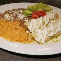Enchilada Suiza (2) · Chicken or cheese enchilada with a rich topping of tomatillo sauce and sour cream.