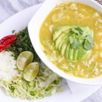 Pozole Verde · Chicken breast, hominy, corn, and tomatillo sauce. Garnished with onions, cilantro, lettuce,...