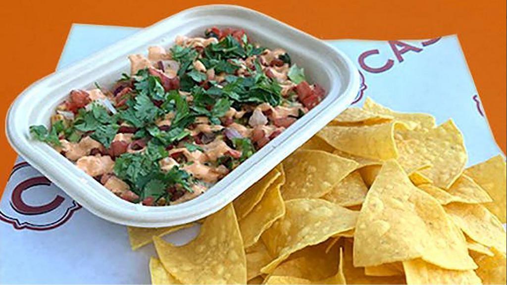 Vegan 7 Layer Dip & Chips · A Reimagined version of the classic and better!  Our housemade vegan white beans, vegan parmesan cheese, grilled corn salsa, pico de gallo, vegan chipotle aioli. cilantro & scallions layered into dipping perfection.  Served with our housemade tortilla chips.     (Also available with vegan whole black beans or 1/2 n' 1/2)