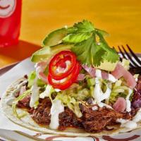 Ancho Chile Shredded Beef Taco · Certified Black Angus, hormone free beef, slow  braised with ancho and guajillo chiles, garl...