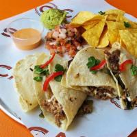 Pork Carnitas Quesadilla · All day roasted pork carnitas accompanied by our housemade pineapple salsa and finished with...