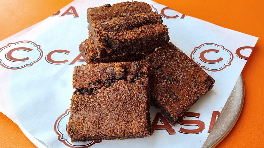 Mexican Chocolate Brownie · House baked with Ibarra Mexican and Guittard chocolates, almond flour, espresso and Madagascar vanilla extracts, spices and cane sugar.  Sinfully rich and 100% gluten free!  
Contains nuts.