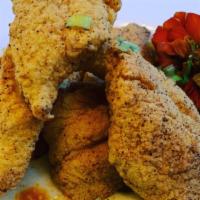 Fried Fish n Grits · Golden Fried Basa over savory grits