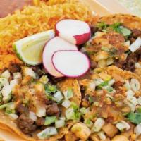 #9 TACO PLATE  · Three tacos with choice of protein; topped with diced onions, cilantro, and hot or mild salsa.