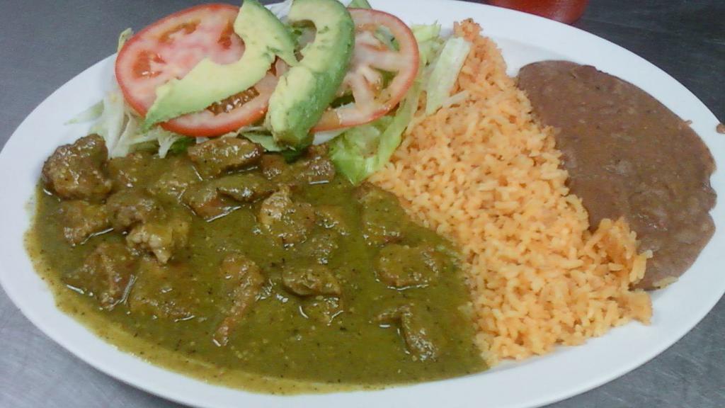 CHILE VERDE · Pork cooked in chile verde sauce; served with rice, refried beans, small salad, and flour or handmade tortillas.
