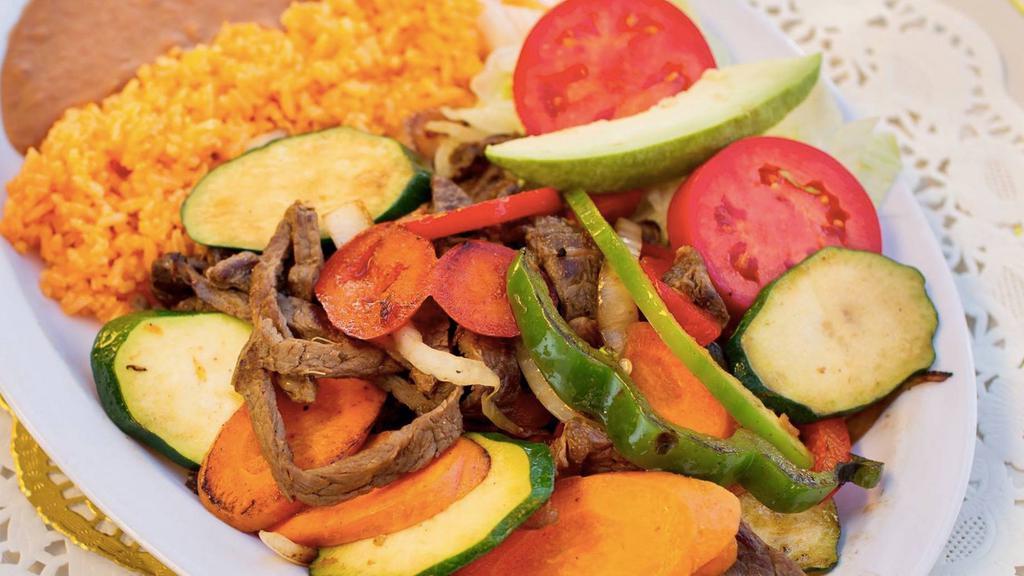 FAJITAS · Grilled steak or chicken with onions and bell peppers; grilled shrimp availbale instead for an additional charge. Served with rice and beans and handmade tortillas.