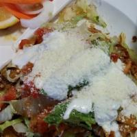  TOSTADA · Toasted corn tortilla topped with refried bean, choice of protein, lettuce, diced tomatoes, ...