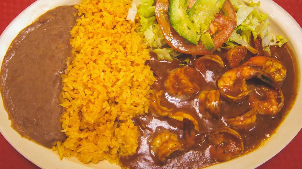 CAMARONES A LA DIABLA · Shrimp in spicy hot sauce; served with Spanish rice, refried beans, a small salad, and handmade corn tortillas.
