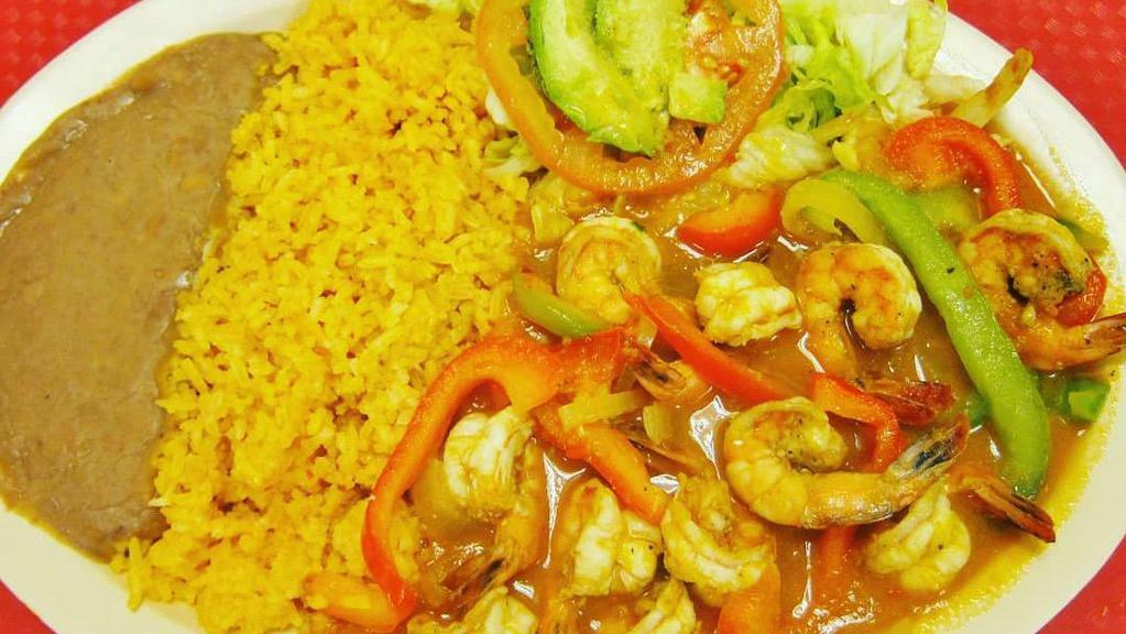 CAMARONES AL MOJO DE AJO · Shrimp in garlic sauce. Served with Spanish rice, refried beans, a side salad, and handmade corn tortillas.