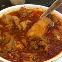 MENUDO · Beef tripe soup served with lime slices, a side of chopped onions, and salsa. Three handmade...