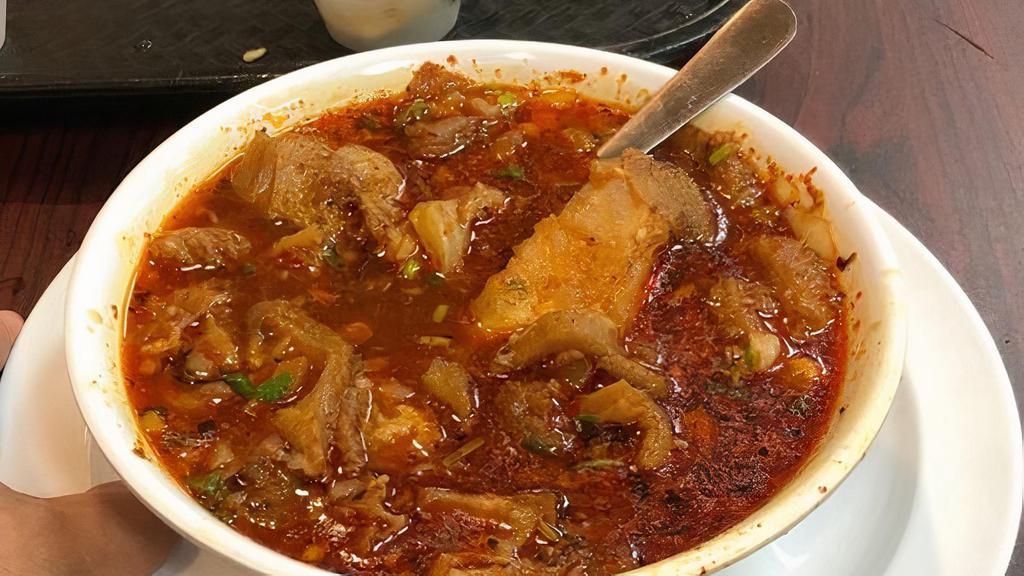 MENUDO · Beef tripe soup served with lime slices, a side of chopped onions, and salsa. Three handmade tortillas included.