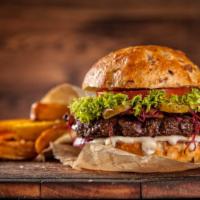 Western Burger · Juicy beef patty with crispy bacon, cheddar cheese, red onion, BBQ sauce, tomato, and lettuc...