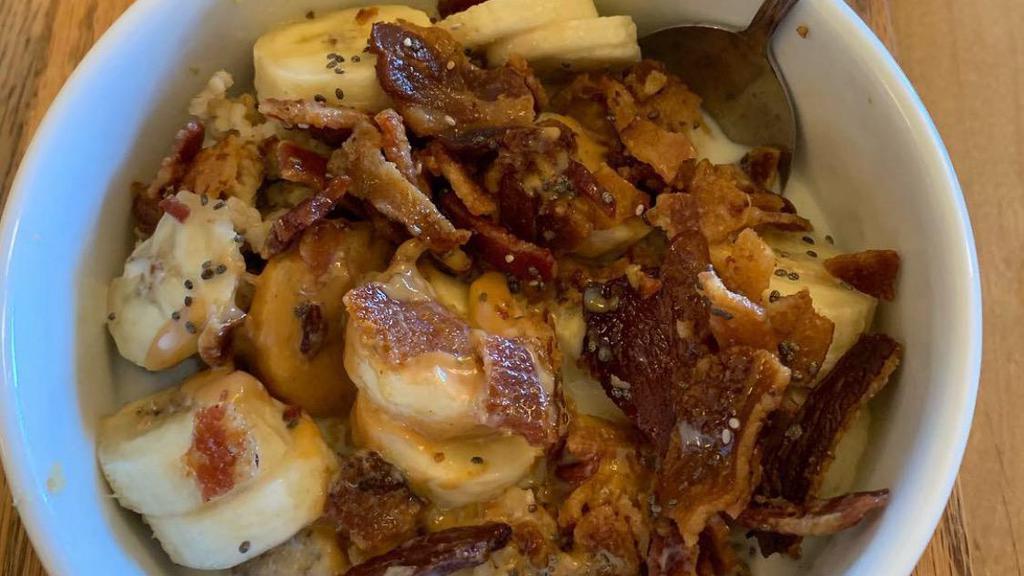 Elvis Steel Cut Oatmeal · Organic steel cut oats, banana, peanut butter, Hobbs bacon crumbles, pure maple syrup, organic chia.