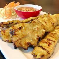 Chicken Satay · Grilled marinated chicken breast. Served with peanut sauce and cucumber salad.