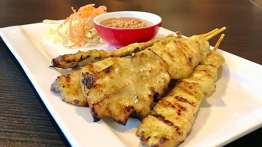 Chicken Satay · Grilled marinated chicken breast. Served with peanut sauce and cucumber salad.
