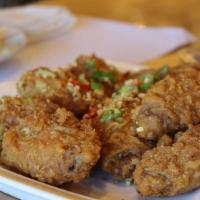 Fried Chicken Wings · Deep-fried marinated chicken wings. Served with sweet sauce.