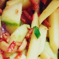 Yum Pla Muek · Calamari, ginger, yellow onion, green onion, sweet chili paste, tomato, and mint. Served wit...