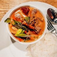 Tom Yum · Hot and sour soup with lemongrass, mushroom, tomato, yellow onion, and green onion with a ch...