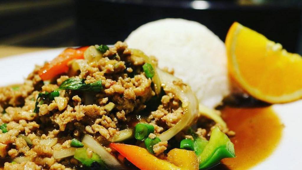 Pad Kra Pow · Green bean, bell pepper, yellow onion, garlic, mushroom, and basil with a choice of ground chicken, pork, beef, or tofu. Served with jasmine rice.