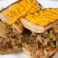 Chicken Philly Cheesesteak · Thin slices of white meat chicken, melted cheese and grilled mushrooms, green peppers and on...
