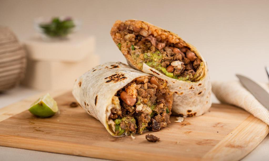 Carne Asada Burrito · A 12 inch tortilla filled with Carne Asada Burrito, rice, beans, avocado, sour cream, onions, cilantro, and salsa.