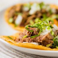 Traditional · Corn tortilla, choice of meat, onions and cilantro.