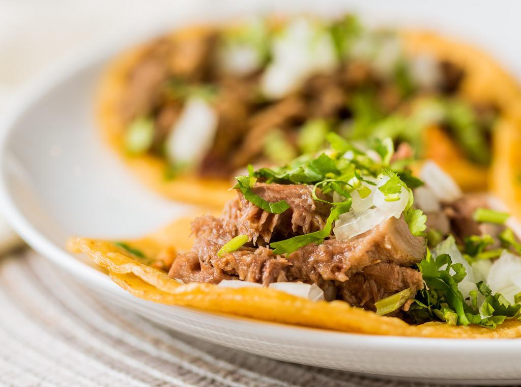 Traditional · Corn tortilla, choice of meat, onions and cilantro.