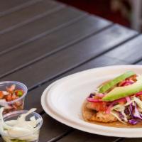 Grilled Fish · Grilled fish topped with cabbage, tomatoes, red onion, metro's tartar sauce and avocado slic...