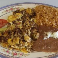Machaca and Egg / Machaca con Huevos · 3 scrambled eggs with shredded beef, tomatoes, onions and bell pepper.includes rice and bean...