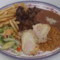 Steak and Eggs / Steak y Huevos · A Steak with two eggs and a side of rice and beans. 
Steak con dos huevos, arroz y frijoles ...
