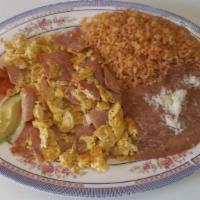 Ham and Eggs / Huevos con Jamon · 3 scrambled eggs & ham . Includes rice and beans and tortillas.