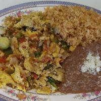 Huevos a La Mexicana · 3 
scrambled eggs with onions, tomatoes & bell pepper, and jalapenos.