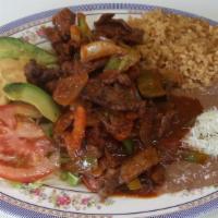 Bistec a La Mexicana · Chopped steak with onions, tomatoes , bell pepper & jalapeno in a spicy red sauce. Includes ...