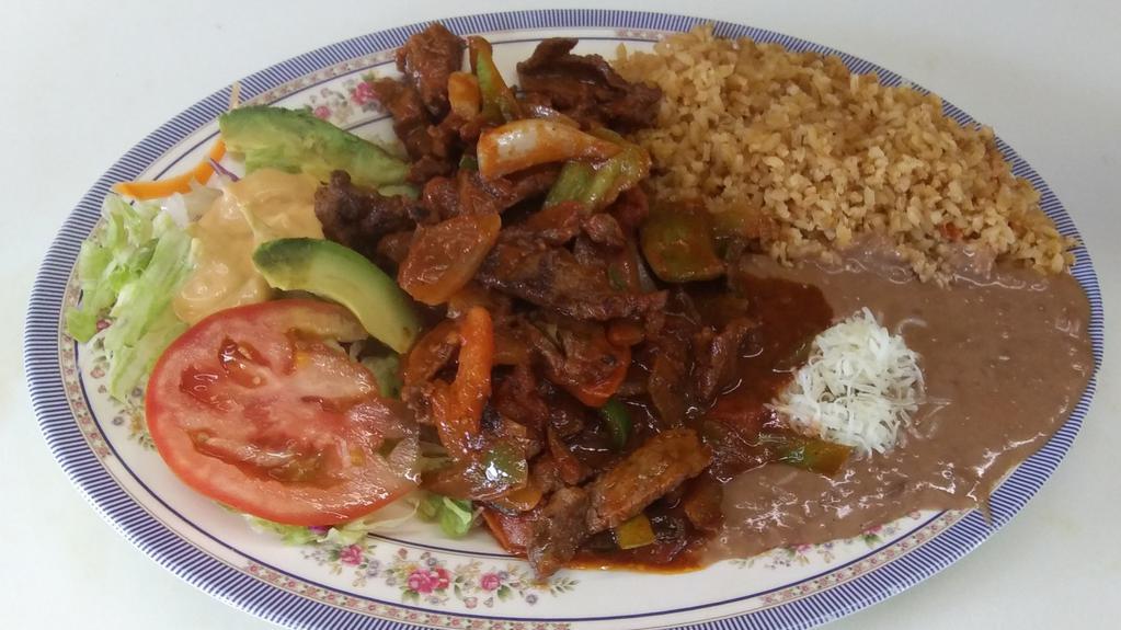 Bistec a La Mexicana · Chopped steak with onions, tomatoes , bell pepper & jalapeno in a spicy red sauce. Includes rice and beans on the side.