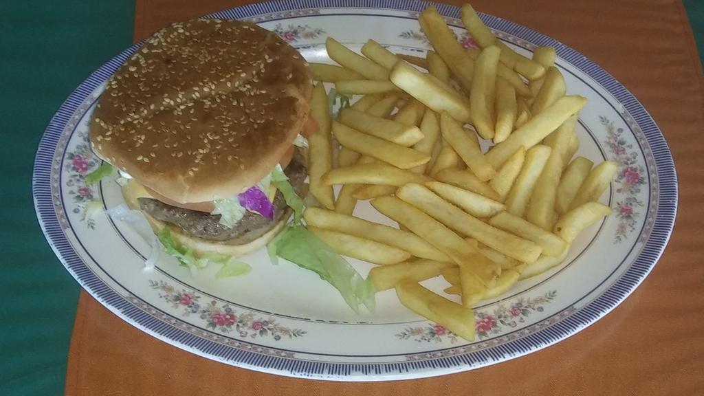 Hamburger · Beef patty with cheese , tomato lettuce and mayonnaise served with french fries.